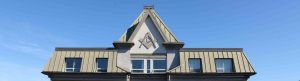 web header image showing the roofline of a Victoria building displaying a Masonic Square & Compasses